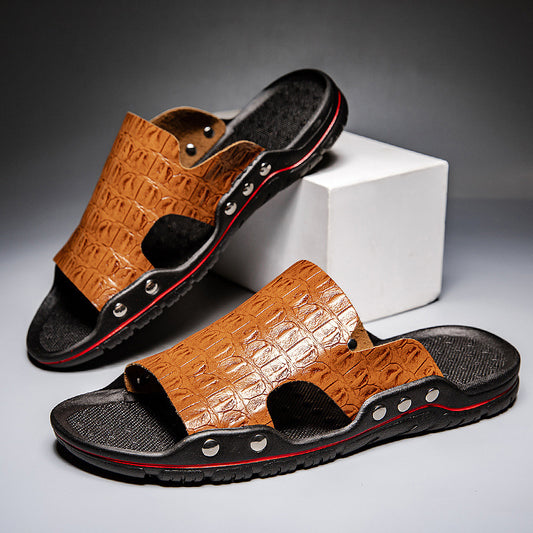 Brown sandals with black soles on a gray background